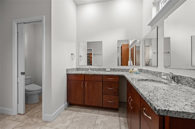 6382 SW 48th Dr, Gainesville, FL 32608 - full bathroom with double vanity, a high ceiling, and tile patterned floors