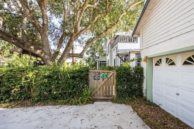 562 NE 2nd Ave, Gainesville, FL 32601 - view of yard with a garage and a gate