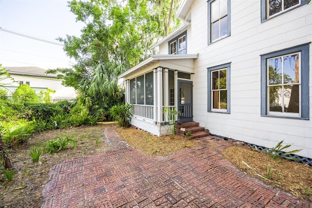 562 NE 2nd Ave, Gainesville, FL 32601 - view of patio / terrace with a sunroom