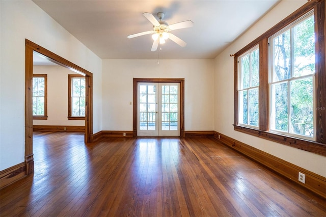 562 NE 2nd Ave, Gainesville, FL 32601 - unfurnished room with dark wood finished floors and a ceiling fan