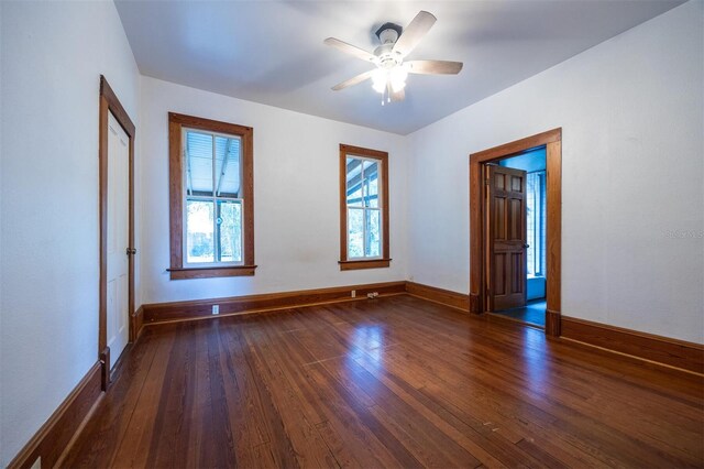 562 NE 2nd Ave, Gainesville, FL 32601 - spare room featuring dark wood finished floors and ceiling fan