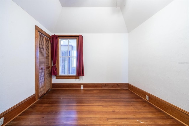 562 NE 2nd Ave, Gainesville, FL 32601 - unfurnished room featuring lofted ceiling and wood finished floors