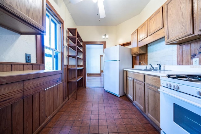 562 NE 2nd Ave, Gainesville, FL 32601 - kitchen featuring white appliances, healthy amount of natural light, backsplash, and a ceiling fan