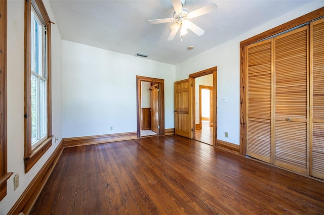 562 NE 2nd Ave, Gainesville, FL 32601 - unfurnished bedroom featuring wood finished floors, a closet, and ceiling fan