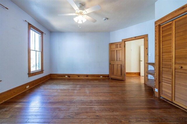 562 NE 2nd Ave, Gainesville, FL 32601 - unfurnished bedroom featuring hardwood / wood-style floors, a closet, and a ceiling fan