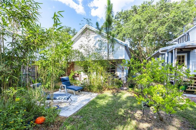 562 NE 2nd Ave, Gainesville, FL 32601 - view of grassy yard with a patio area
