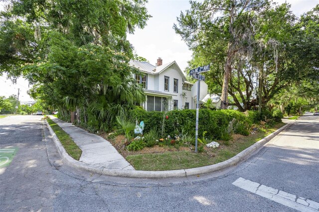 562 NE 2nd Ave, Gainesville, FL 32601 - view of front of home with a metal roof and a chimney