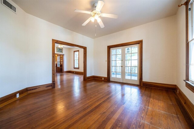 562 NE 2nd Ave, Gainesville, FL 32601 - unfurnished room with wood-type flooring, french doors, and ceiling fan
