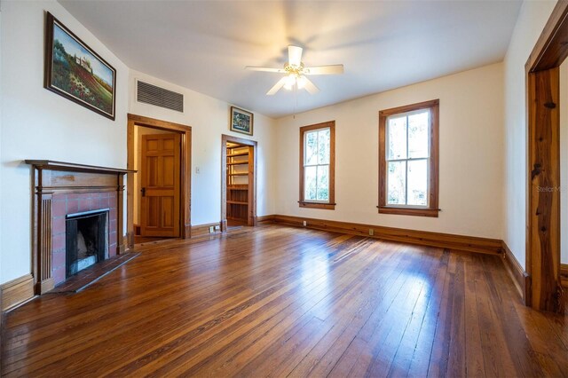 562 NE 2nd Ave, Gainesville, FL 32601 - unfurnished living room with hardwood / wood-style flooring, ceiling fan, and a fireplace