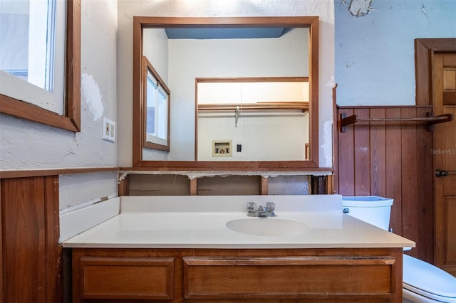 562 NE 2nd Ave, Gainesville, FL 32601 - bathroom with wainscoting and vanity