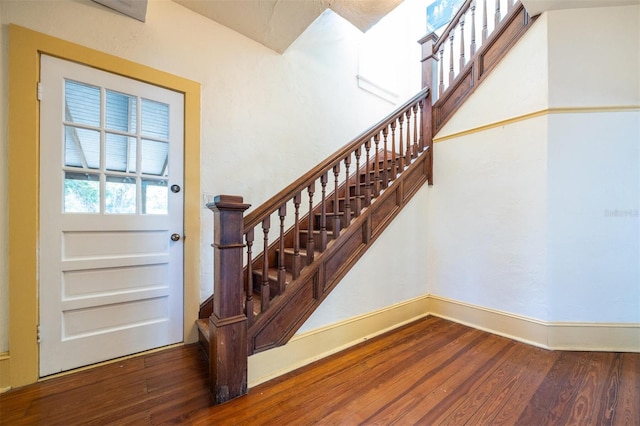 562 NE 2nd Ave, Gainesville, FL 32601 - stairs with wood finished floors and baseboards