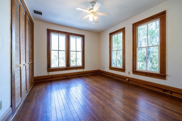 562 NE 2nd Ave, Gainesville, FL 32601 - empty room with dark wood-style floors and ceiling fan