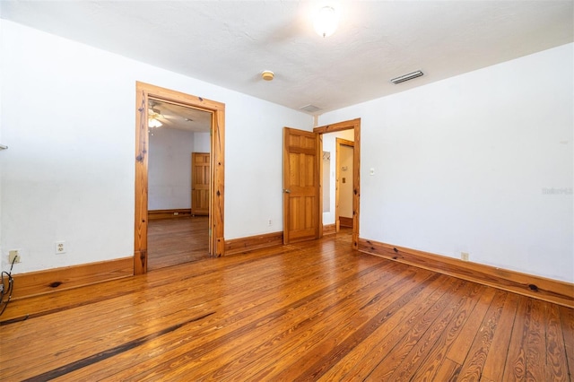 562 NE 2nd Ave, Gainesville, FL 32601 - empty room featuring hardwood / wood-style floors and a smoke detector