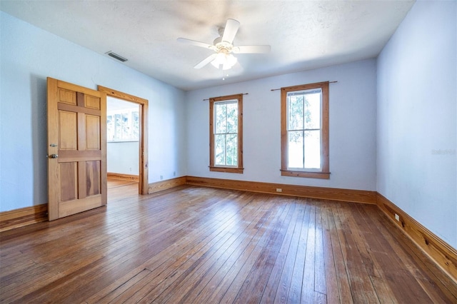 562 NE 2nd Ave, Gainesville, FL 32601 - spare room featuring wood-type flooring and ceiling fan