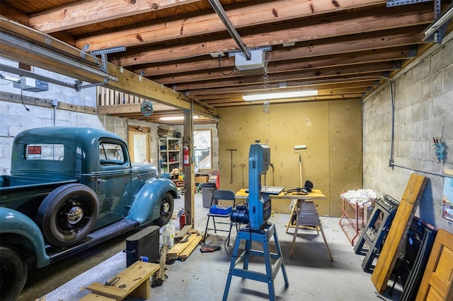 562 NE 2nd Ave, Gainesville, FL 32601 - garage with a garage door opener and concrete block wall