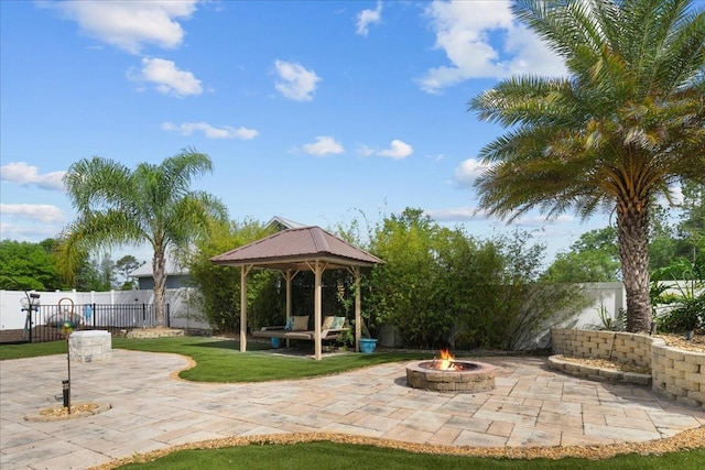 9835 SW 80th Pl, Hampton, FL 32044 - view of patio / terrace featuring an outdoor fire pit, a gazebo, and a fenced backyard