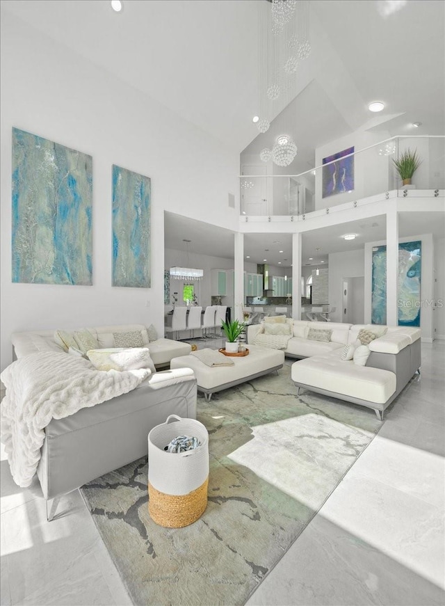 9835 SW 80th Pl, Hampton, FL 32044 - living room featuring recessed lighting, a notable chandelier, and a high ceiling