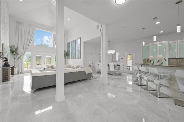 9835 SW 80th Pl, Hampton, FL 32044 - living room with recessed lighting, a towering ceiling, and marble finish floor
