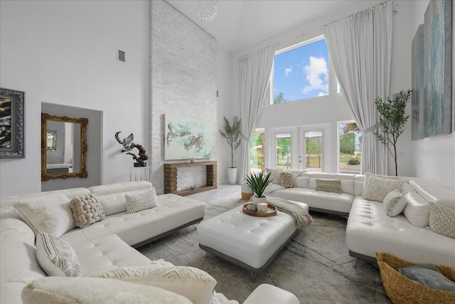 9835 SW 80th Pl, Hampton, FL 32044 - living area featuring visible vents, a towering ceiling, and a healthy amount of sunlight