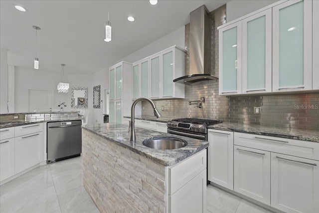9835 SW 80th Pl, Hampton, FL 32044 - kitchen with dark stone countertops, a kitchen island with sink, wall chimney exhaust hood, decorative backsplash, and dishwashing machine