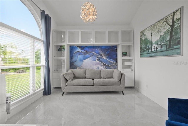 9835 SW 80th Pl, Hampton, FL 32044 - sitting room featuring baseboards, marble finish floor, a chandelier, and a healthy amount of sunlight
