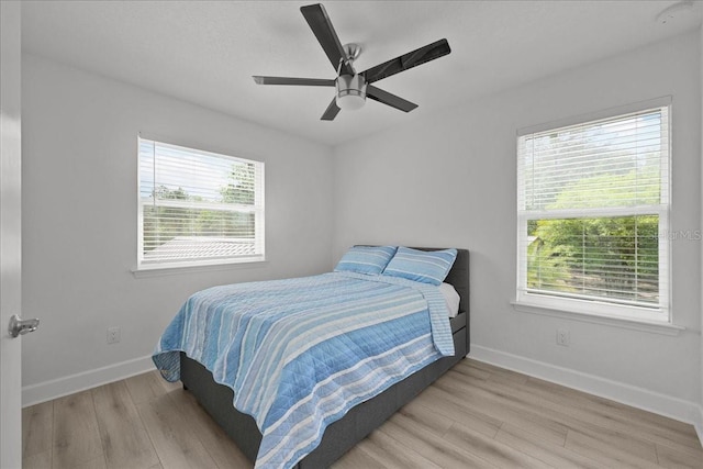 9835 SW 80th Pl, Hampton, FL 32044 - bedroom featuring baseboards, a ceiling fan, and wood finished floors