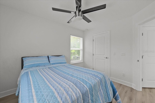 9835 SW 80th Pl, Hampton, FL 32044 - bedroom featuring light wood-style flooring, baseboards, and a ceiling fan