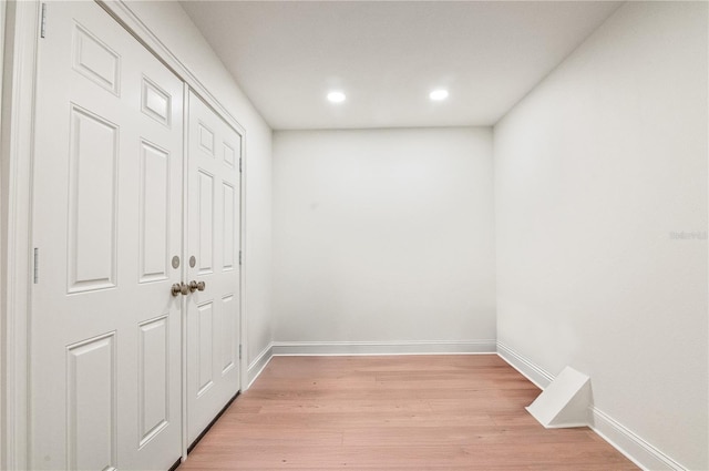 interior space with recessed lighting, light wood-style floors, and baseboards