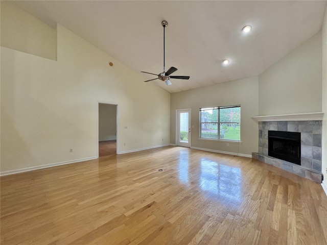 11795 Creek Dr, Alachua, FL 32615 - unfurnished living room with high vaulted ceiling, light wood-type flooring, baseboards, and ceiling fan