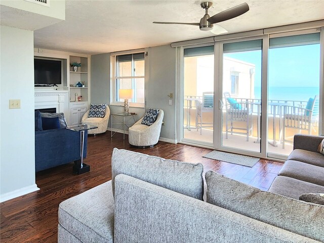 3370 Ocean Shore Blvd Unit 5020, Ormond Beach, FL 32176 - living room featuring a ceiling fan, baseboards, and wood finished floors