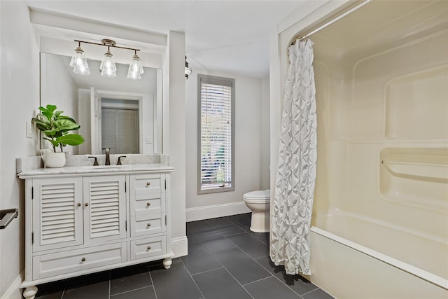 bathroom featuring vanity, tile patterned flooring, toilet, shower / tub combo with curtain, and baseboards