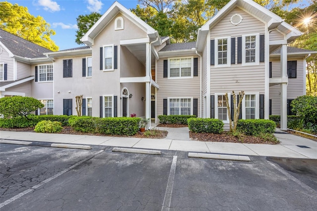 10000 SW 52nd Ave Unit 77, Gainesville, FL 32608 - view of front facade with uncovered parking and stucco siding
