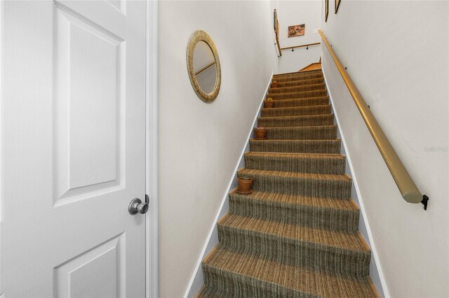 10000 SW 52nd Ave Unit 77, Gainesville, FL 32608 - stairway featuring baseboards