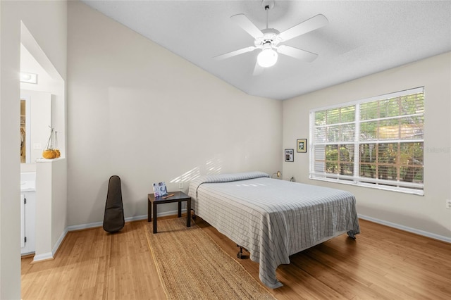10000 SW 52nd Ave Unit 77, Gainesville, FL 32608 - bedroom with light wood-style flooring, baseboards, a ceiling fan, and lofted ceiling