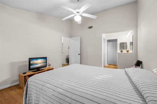 10000 SW 52nd Ave Unit 77, Gainesville, FL 32608 - bedroom featuring high vaulted ceiling, a ceiling fan, visible vents, wood finished floors, and baseboards
