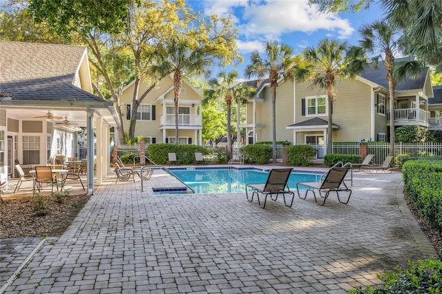 10000 SW 52nd Ave Unit 77, Gainesville, FL 32608 - community pool featuring a patio area and fence