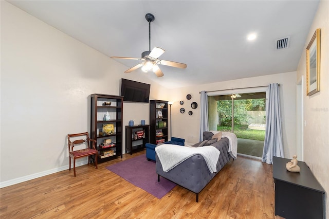 3118 NW 79th Ct, Gainesville, FL 32606 - living room featuring light wood-type flooring, a ceiling fan, and baseboards
