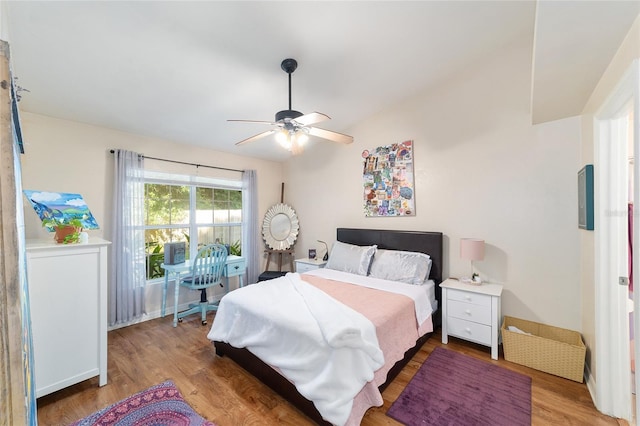 3118 NW 79th Ct, Gainesville, FL 32606 - bedroom with wood finished floors, lofted ceiling, and ceiling fan