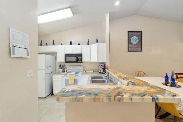 3118 NW 79th Ct, Gainesville, FL 32606 - kitchen featuring white appliances, vaulted ceiling, a sink, a peninsula, and white cabinetry