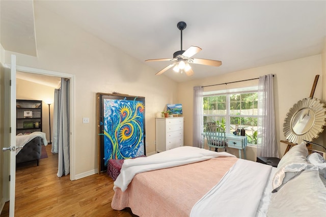 3118 NW 79th Ct, Gainesville, FL 32606 - bedroom with vaulted ceiling, light wood-type flooring, baseboards, and ceiling fan