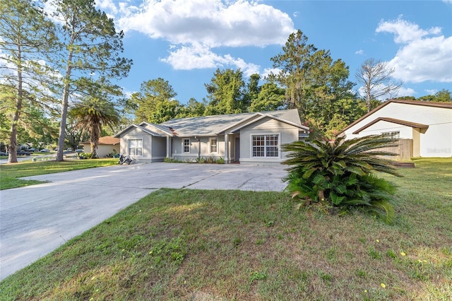 3118 NW 79th Ct, Gainesville, FL 32606 - single story home with a front lawn, driveway, and stucco siding