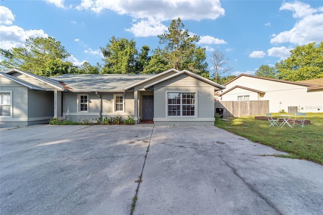 3118 NW 79th Ct, Gainesville, FL 32606 - ranch-style home featuring stucco siding, central AC, and concrete driveway