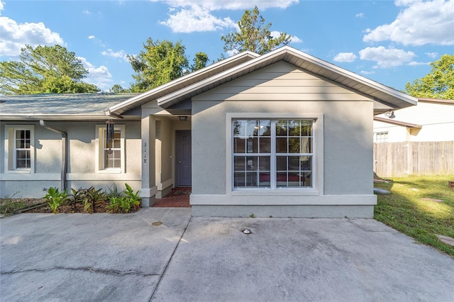 3118 NW 79th Ct, Gainesville, FL 32606 - view of front of home featuring stucco siding and a patio