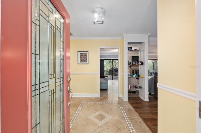 4714 NW 19th Pl, Gainesville, FL 32605 - entryway with visible vents, baseboards, and crown molding