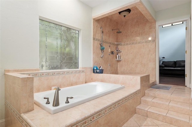 4714 NW 19th Pl, Gainesville, FL 32605 - full bathroom with a tile shower, tile patterned flooring, and a garden tub
