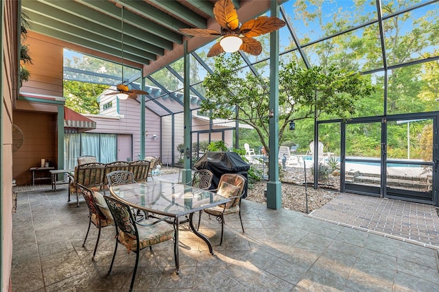4714 NW 19th Pl, Gainesville, FL 32605 - sunroom with ceiling fan and outdoor dining area