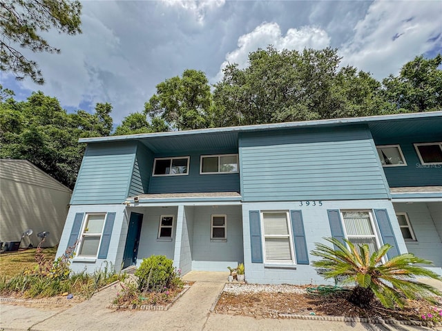 3935 SW 26th Ter Unit 3935A, Gainesville, FL 32608 - townhome / multi-family property with concrete block siding and covered porch