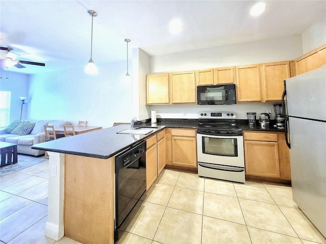 kitchen with black appliances, light brown cabinets, a sink, and a peninsula