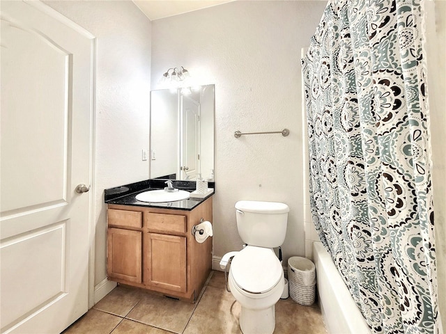 bathroom with tile patterned floors, vanity, toilet, and shower / bathtub combination with curtain