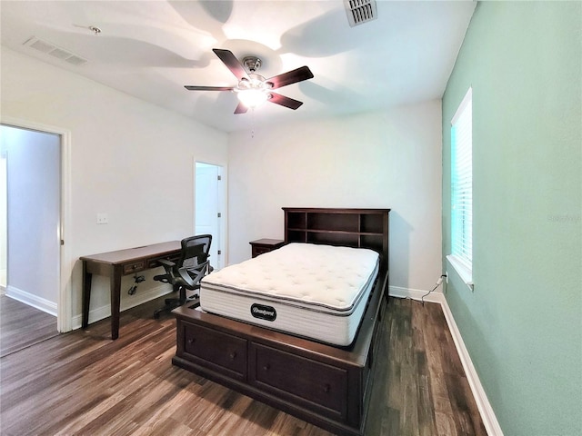 bedroom with dark wood-type flooring, baseboards, and a ceiling fan